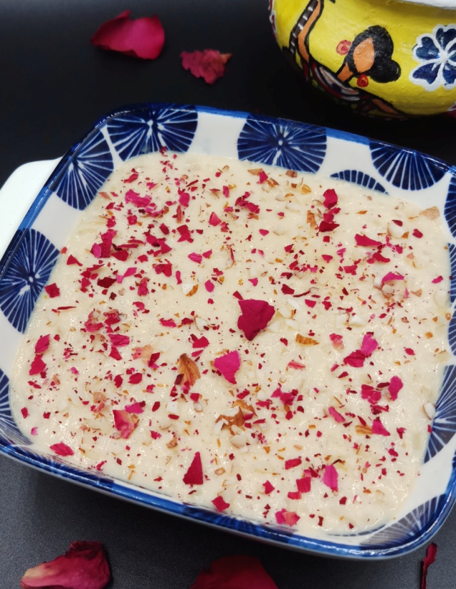 Kheer| Rice Kheer is served in white based blue flower bowl.