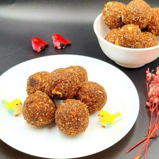 Til Ke Laddoo - Sweet Sesame Seed Balls on white plate.