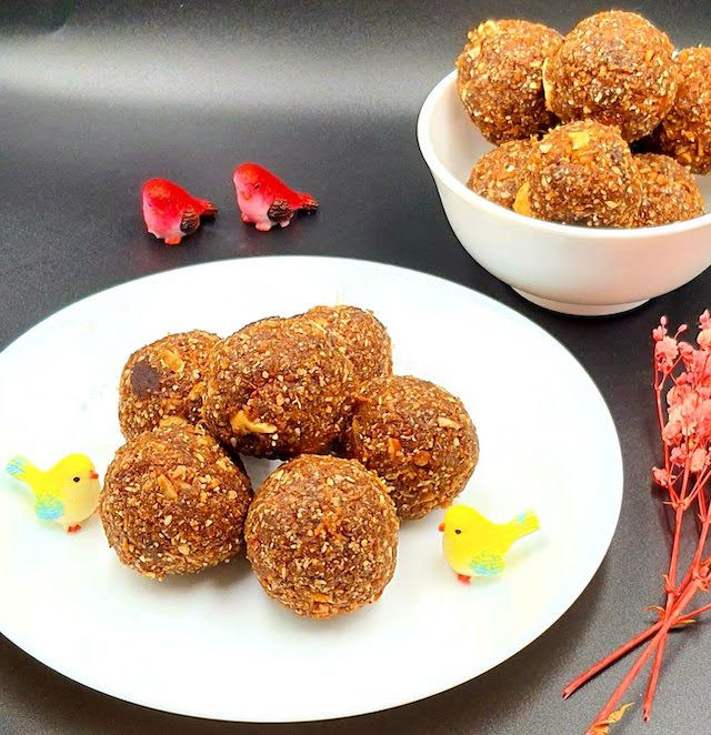 Til Ke Laddoo - Sweet Sesame Seed Balls on white plate.