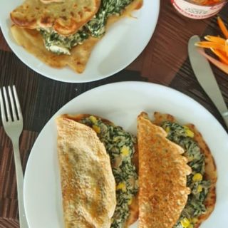 Stuffed Wheat Flour Chilla on white plate.