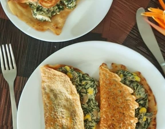 Stuffed Wheat Flour Chilla on white plate.