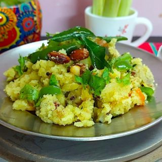 A plate of Sooji Upma garnished with fresh coriander leaves.