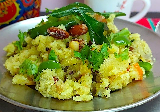 A plate of Sooji Upma garnished with fresh coriander leaves.