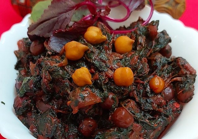 Lal Saag/Cholye/Red Spinach/Amarnath with bengal grams, symbolising the dish's rich flavors and nutritional value.