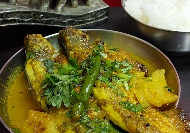 Pabda Fish Curry Recipe served white rice.