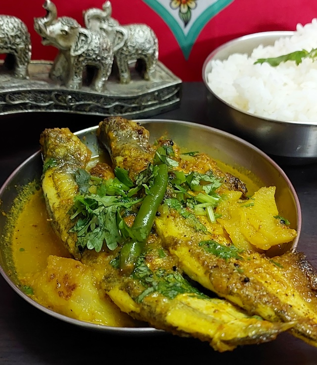 Pabda Fish Curry Recipe served white rice.
