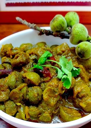 Flavourful Gular Ki Sabji served in a white bowl.