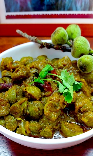 Flavourful Gular Ki Sabji served in a white bowl.